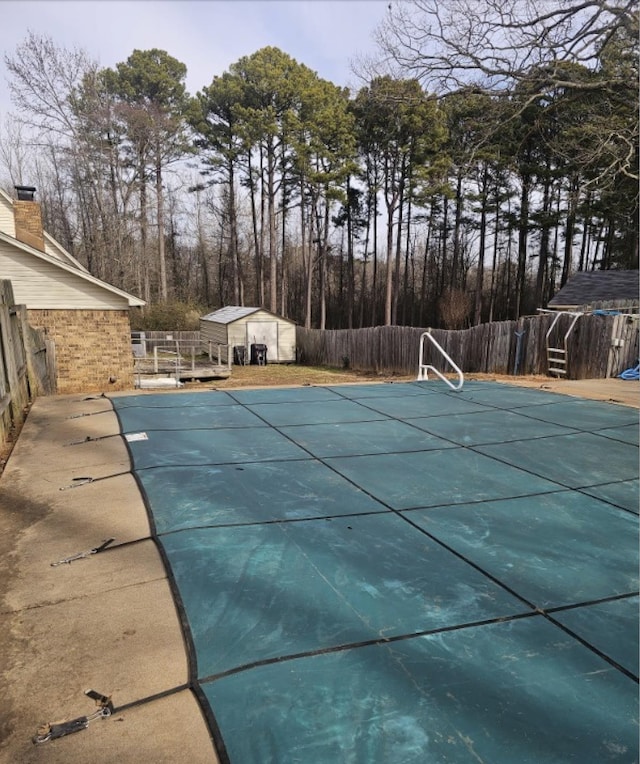 view of pool featuring a storage shed