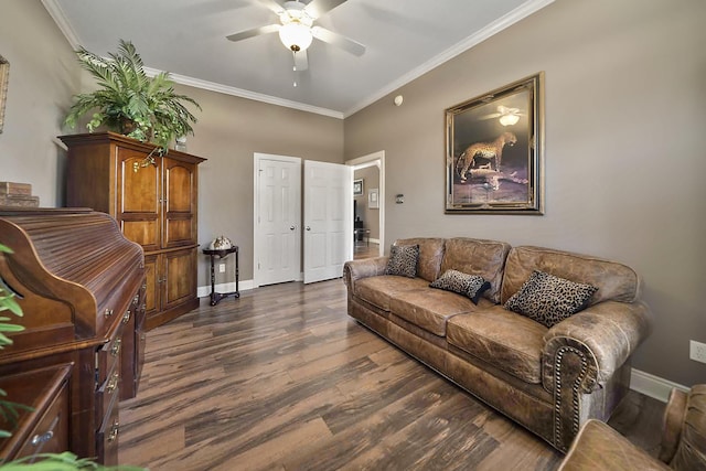 living room with ornamental molding, dark hardwood / wood-style flooring, and ceiling fan