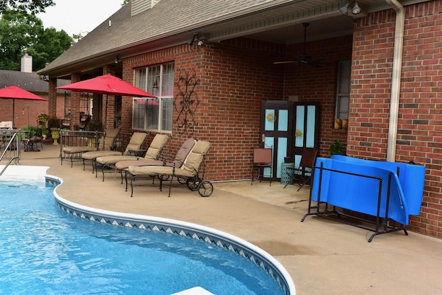 view of pool featuring ceiling fan and a patio