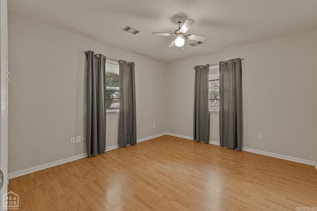 spare room with ceiling fan and light hardwood / wood-style flooring