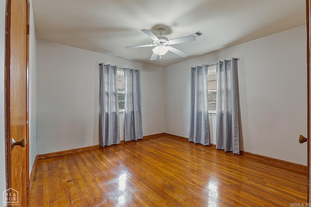 empty room with light hardwood / wood-style floors and ceiling fan