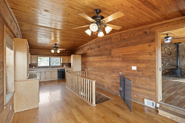 interior space featuring lofted ceiling, sink, wooden ceiling, and light hardwood / wood-style floors