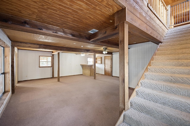 basement featuring carpet flooring and wooden ceiling