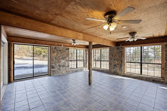 unfurnished sunroom featuring a wealth of natural light and wooden ceiling