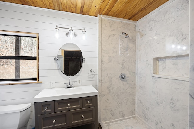 bathroom featuring wood ceiling, vanity, a shower, toilet, and wood walls