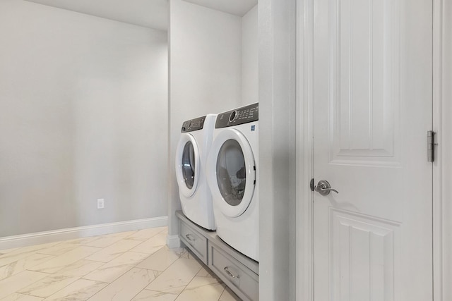 clothes washing area with washing machine and clothes dryer