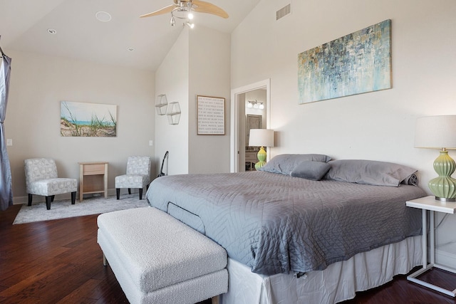 bedroom with dark hardwood / wood-style flooring, high vaulted ceiling, and ceiling fan