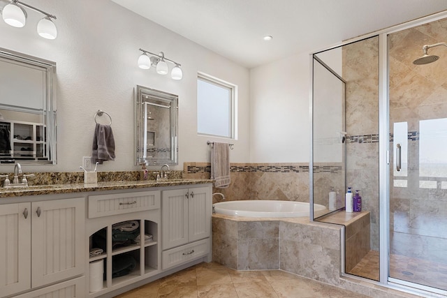 bathroom with vanity, plus walk in shower, and tile patterned flooring