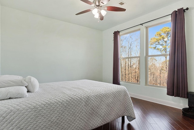 bedroom featuring dark hardwood / wood-style floors and ceiling fan