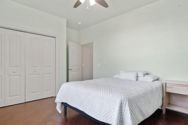 bedroom with wood-type flooring, ceiling fan, and a closet