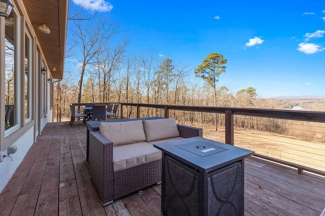 wooden terrace featuring an outdoor living space