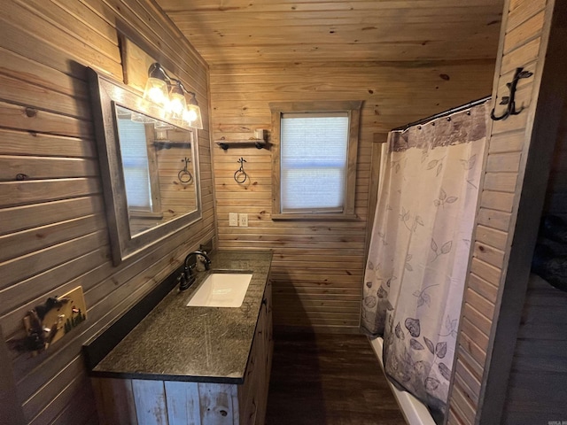 bathroom featuring vanity, wood ceiling, curtained shower, and wood walls