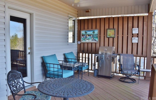 wooden deck featuring area for grilling