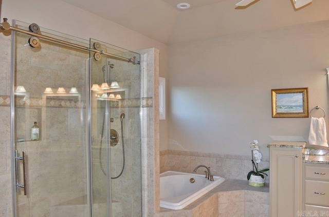 bathroom featuring shower with separate bathtub, lofted ceiling, and ceiling fan