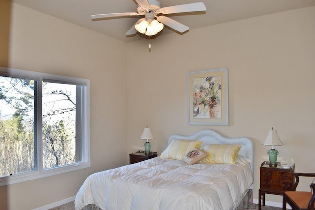 carpeted bedroom featuring a ceiling fan