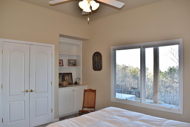 bedroom featuring a ceiling fan and a closet