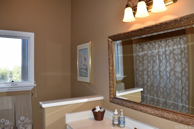 bathroom featuring a notable chandelier