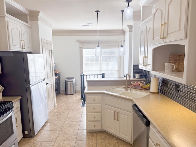 kitchen featuring white cabinetry, sink, hanging light fixtures, stainless steel appliances, and crown molding