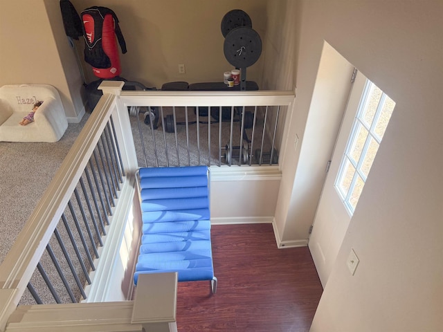 stairs featuring hardwood / wood-style flooring