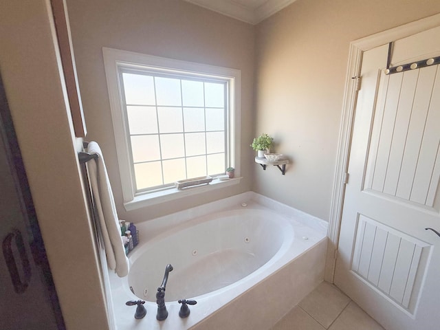 bathroom featuring tile patterned flooring, a bathing tub, and ornamental molding