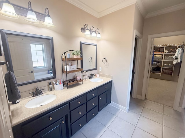 bathroom featuring ornamental molding, a tub to relax in, tile patterned floors, and vanity