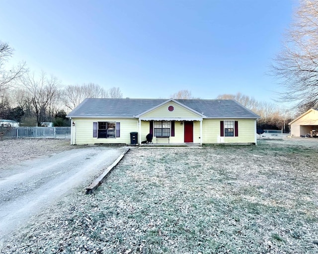 single story home featuring covered porch