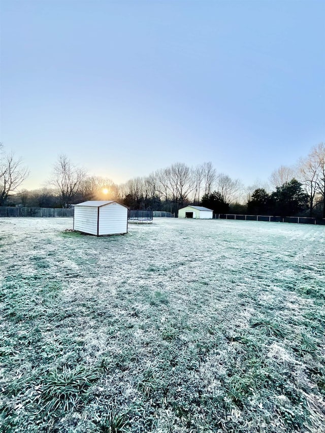 view of yard with a storage unit