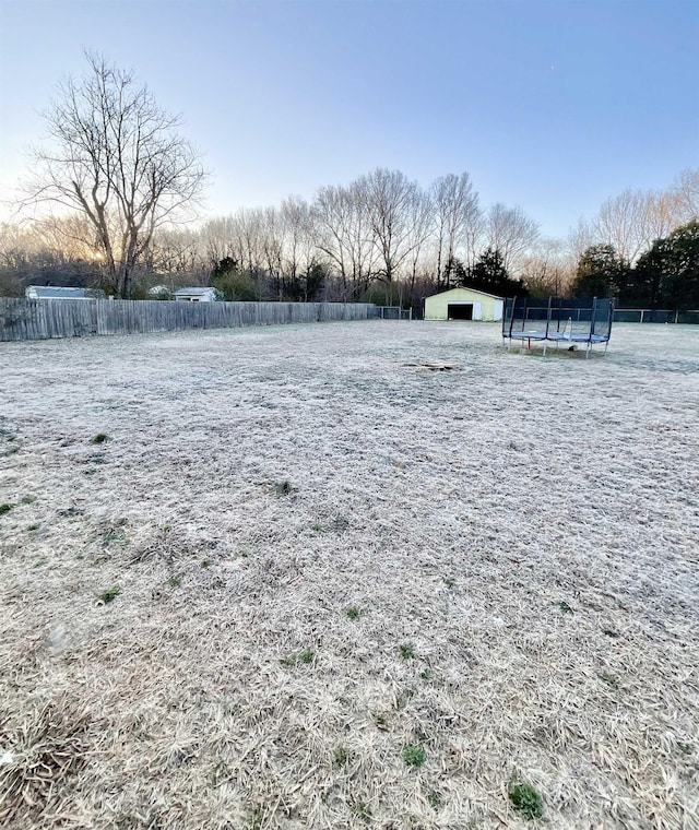 view of yard featuring a trampoline
