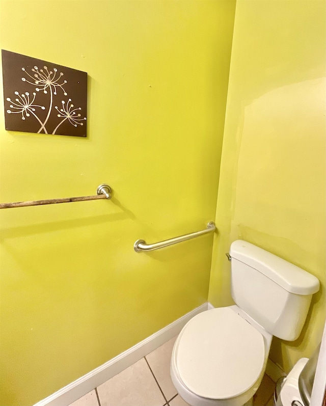 bathroom featuring toilet and tile patterned flooring
