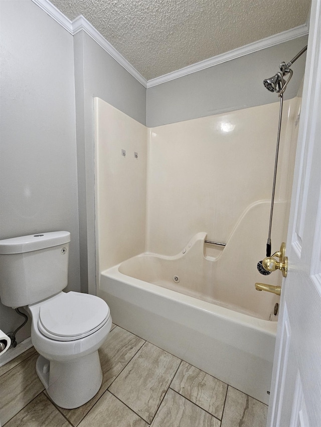 bathroom with crown molding, a textured ceiling, tub / shower combination, and toilet