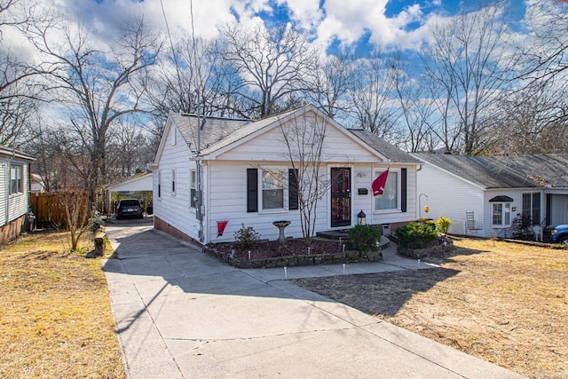 view of front of home with a carport