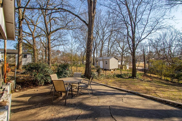 view of patio featuring a storage shed