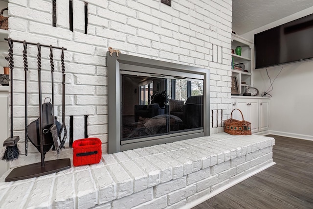 details with hardwood / wood-style flooring and a textured ceiling