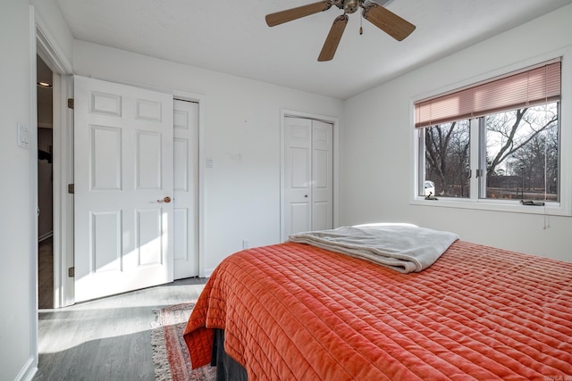 bedroom with wood-type flooring and ceiling fan