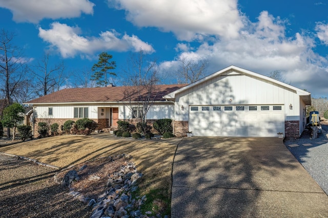 single story home with a garage and a front yard