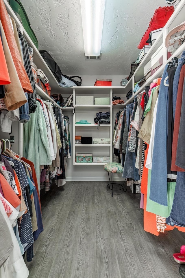 spacious closet featuring hardwood / wood-style flooring