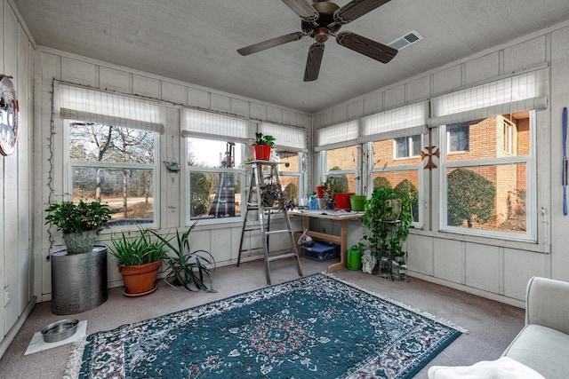 sunroom featuring ceiling fan