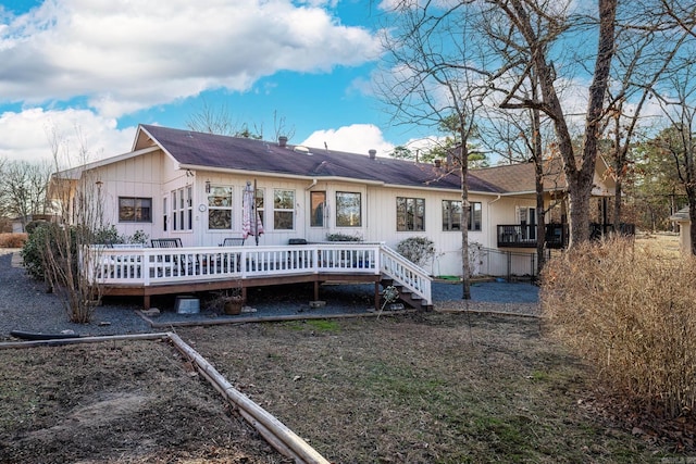 rear view of property featuring a deck