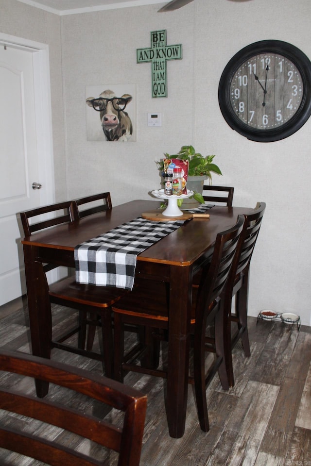 dining space featuring dark hardwood / wood-style flooring