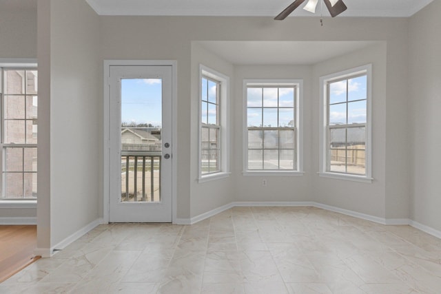 interior space featuring ceiling fan