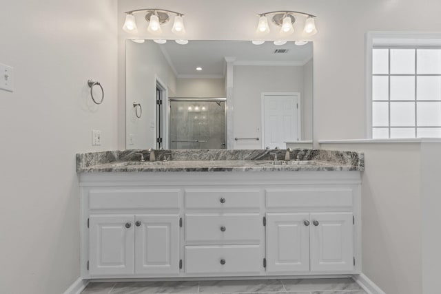 bathroom with vanity, ornamental molding, and walk in shower