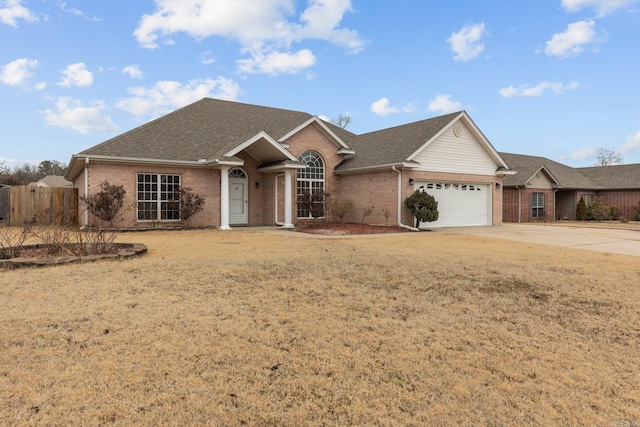 single story home featuring a garage and a front lawn