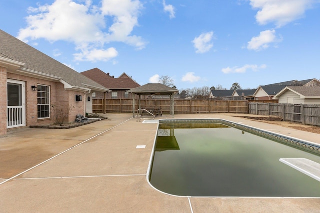 view of swimming pool with a gazebo and a patio