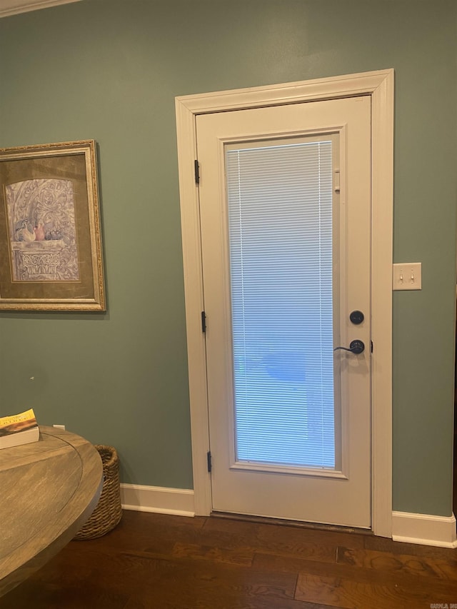 doorway to outside featuring dark wood-type flooring