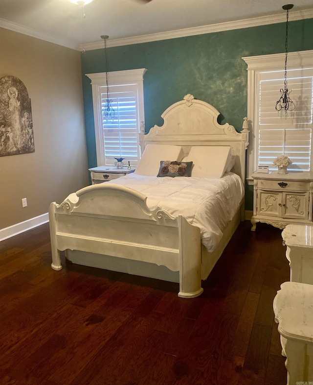 bedroom featuring dark hardwood / wood-style flooring and crown molding