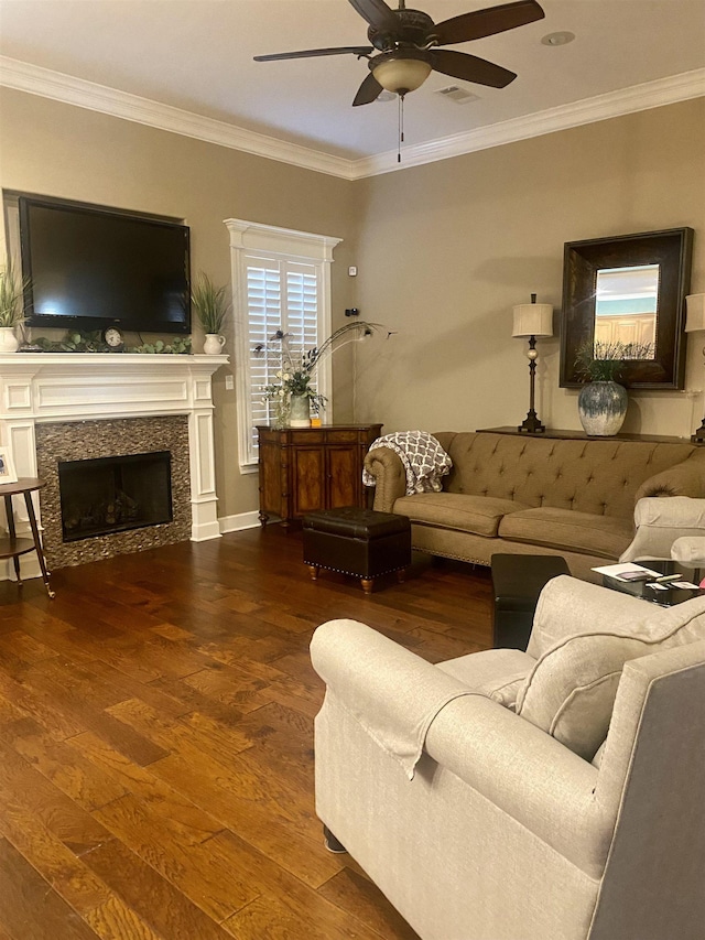 living room featuring dark wood-type flooring, ceiling fan, and crown molding