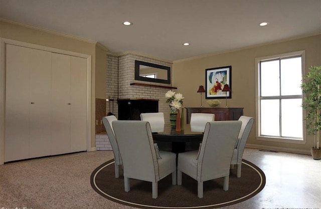 dining area featuring a fireplace and ornamental molding