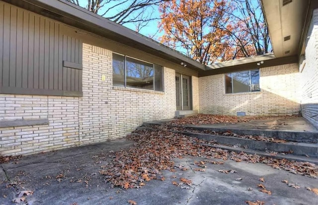 property entrance with a patio area