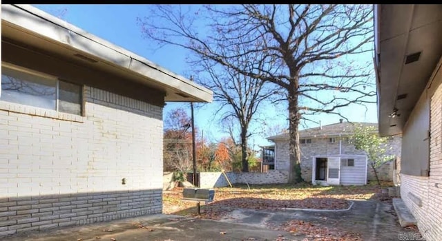 exterior space with an outbuilding and a patio area