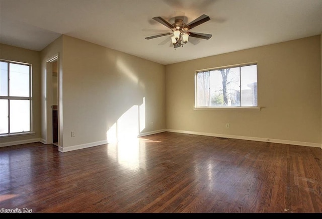 unfurnished room featuring dark hardwood / wood-style flooring and ceiling fan